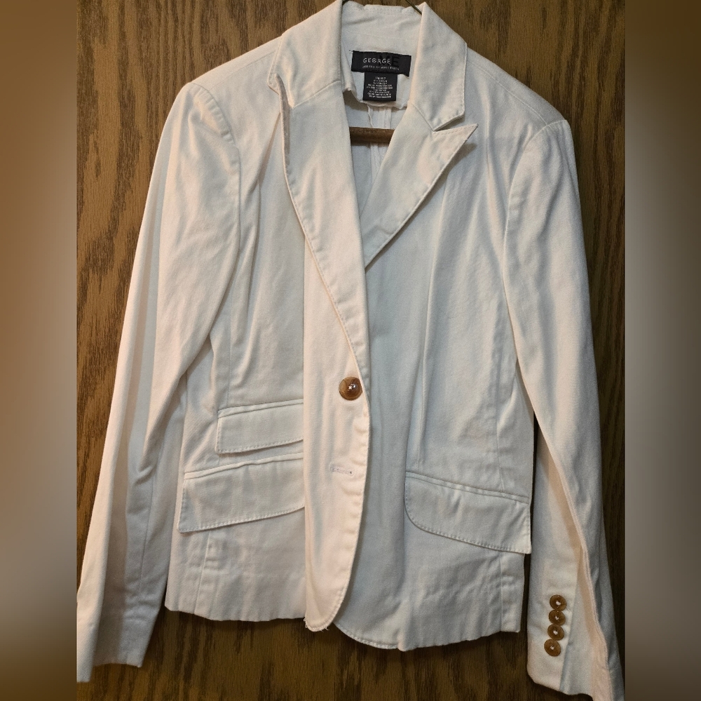 Pretty white blazer. 2 button front closure. Great condition.